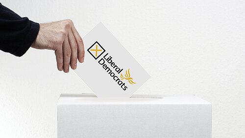 A liberal democrat ballot going into a ballot box.